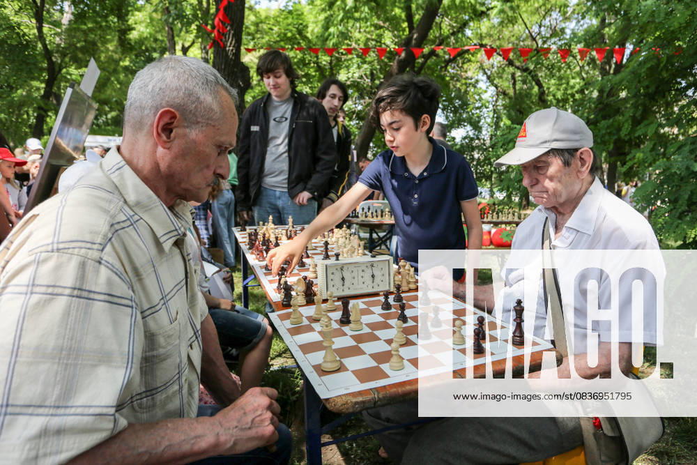 Children s holiday in Odessa, Ukraine - 31 May 2022 May 31, 2022, Odessa, Ukraine: Children and the elderly people seen playing chess at the children s party in Odessa People s Church. In connection with the military actions of the Russian Federation, there are many internally displaced people in Odessa. Children s holiday was organized for them and their children.