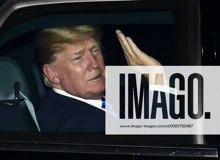 Trump in Singapore U.S. President Donald Trump waves to the crowd after arriving in Singapore on June 10, 2018.