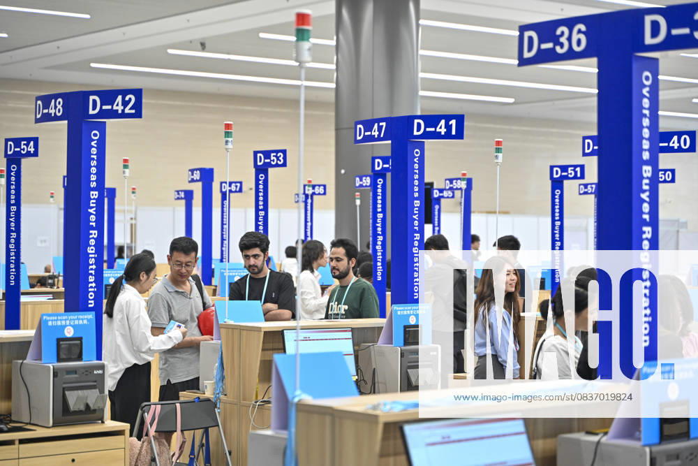 Overseas buyers handle their certificates at the Canton Fair Complex, the venue of the upcoming 138th China Import and Export Fair (Canton Fair), on October 13, 2025 in Guangzhou, Guangdong Province of China. The 138th edition of the China Import and Export Fair, also known as the Canton Fair, will be held from October 15 to November 4 at the Canton Fair Complex in Guangzhou.