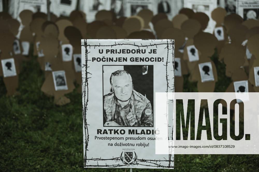 Bosnia marks Prijedor Victims on the White Ribbon Day SARAJEVO, BOSNIA AND HERZEGOVINA - MAY 31: Pictures of war criminals Former Bosnian Serb General Ratko Mladic and ex-Republika Srpska leader Radovan Karadzic are seen as pictures of the victims who were killed in wartime by Serbs in city of Prijedor are being displayed during White Ribbon Day in Sarajevo, Bosnia and Herzegovina on May 31, 2021. White Ribbon Day has been marked since 2012 to remember the civilians who put white ribbons on their arms and hang white sheets on their houses, were identified and killed by the Serbian soldiers in the city of Prijedor and its surrounding area during the war in 1992. Saraybosna Bosna Hersek. Editorial use only. Please get in touch for any other