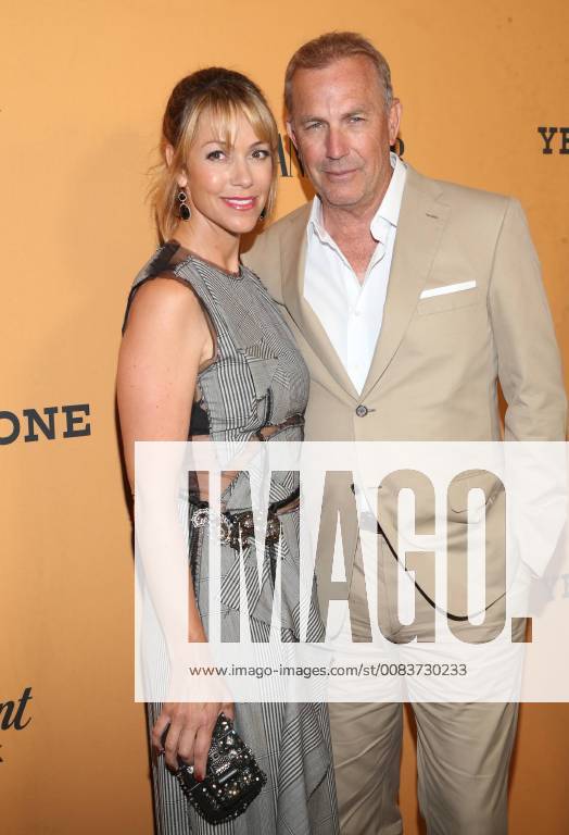 LOS ANGELES, CA - JUNE 11:Christine Baumgartner and Kevin Costner at the premiere of Yellowstone at Paramount Studios in Los Angeles, California on June 11, 2018.