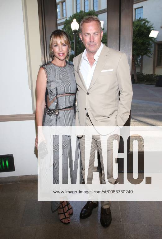 LOS ANGELES, CA - JUNE 11:Christine Baumgartner and Kevin Costner at the premiere of Yellowstone at Paramount Studios in Los Angeles, California on June 11, 2018.