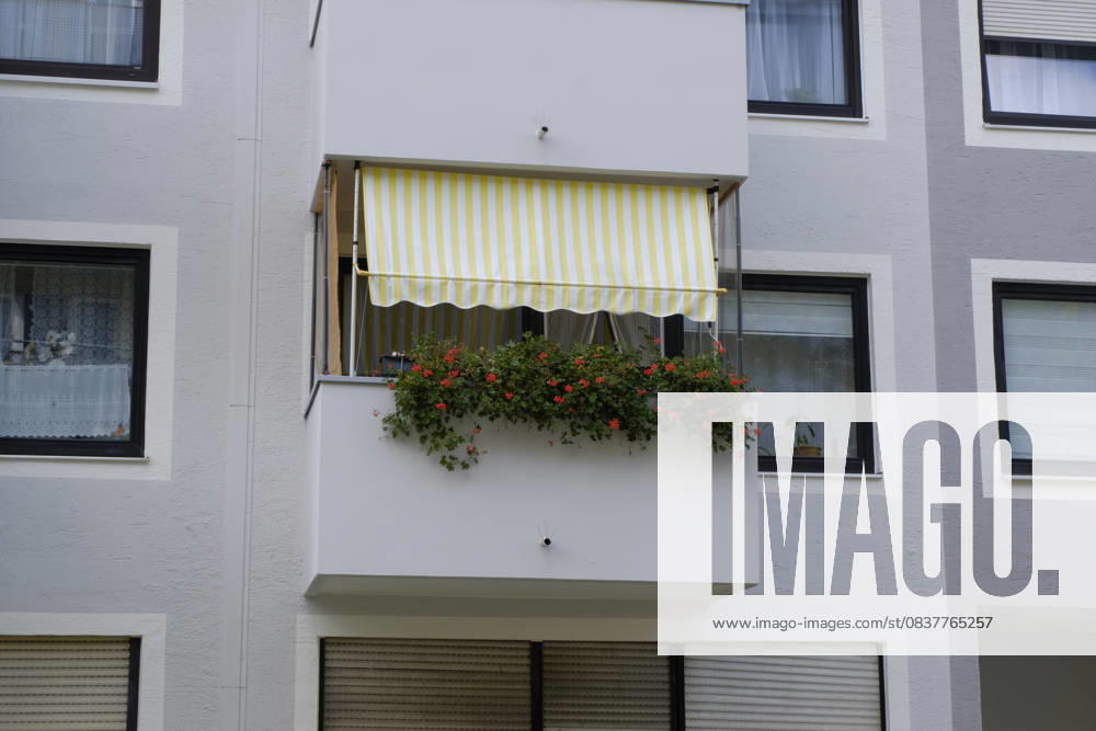 Awning and flowers on the balcony Awning and flowers on the balcony Munich RECORD DATE NOT STATED