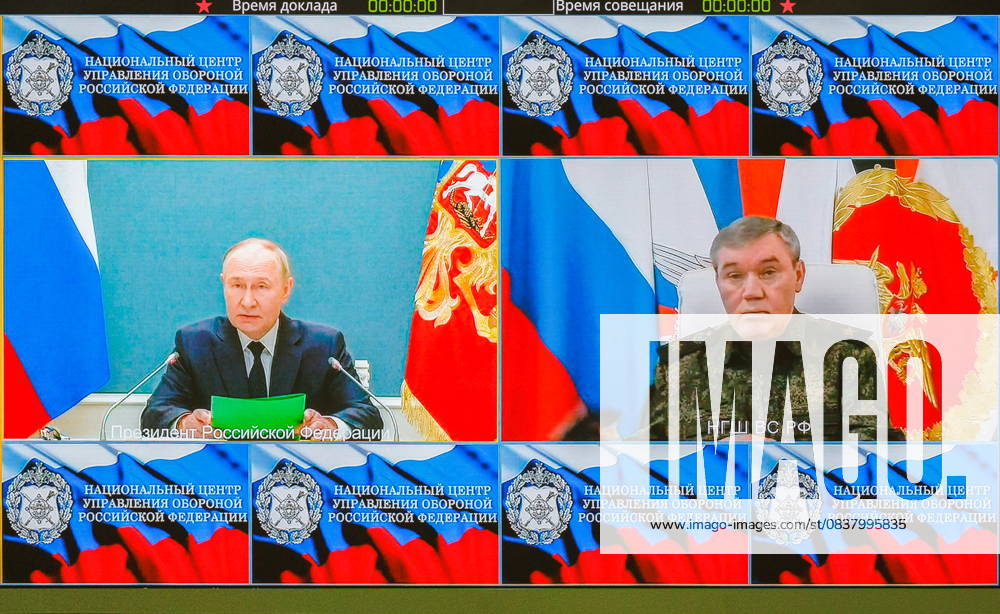 RUSSIA, MOSCOW - OCTOBER 22, 2025: President of Russia Vladimir Putin and Chief of the General Staff of the Russian Armed Forces Army General Valery Gerasimov (L-R on the screen) attend a strategic nuclear forces drill via video link. Vadim Savitsky Russian Defence Ministry Press Office TASS 85051665
