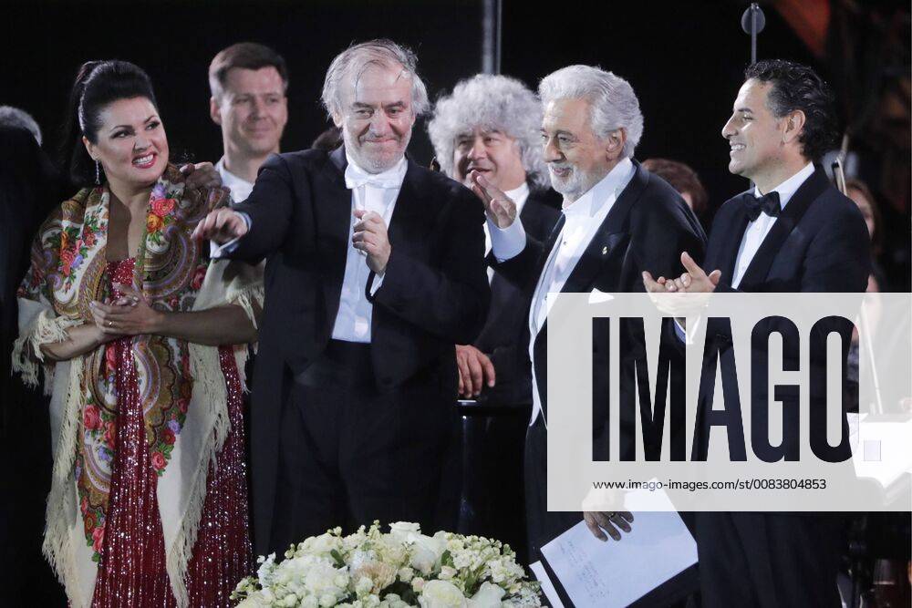 MOSCOW, RUSSIA – JUNE 13, 2018: Russian soprano Anna Netrebko, Mariinsky Theatre artistic director, conductor Valery Gergiev, Spanish tenor Placido Domingo, and Peruvian tenor Juan Diego Florez (L-R front) perform during concert by opera stars ahead of the 2018 FIFA World Cup, at Moscow s Red Square. Mikhail Metzel TASS TS083FE1