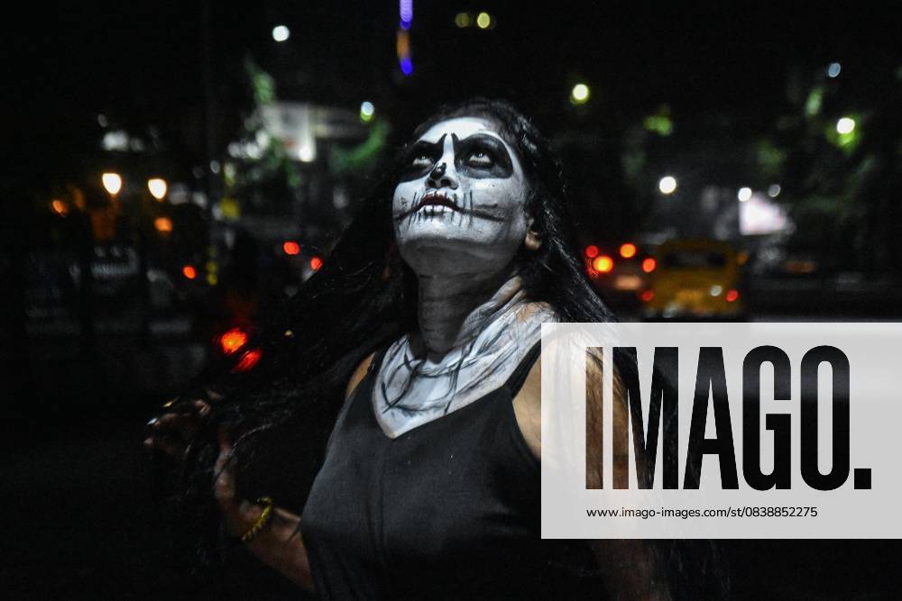 Halloween Celebration In India. A lady dressed in a ghost costume poses for the camera as she participates in a dressing competition ahead of the Halloween celebration in Kolkata, India, on October 30, 2025. Kolkata India