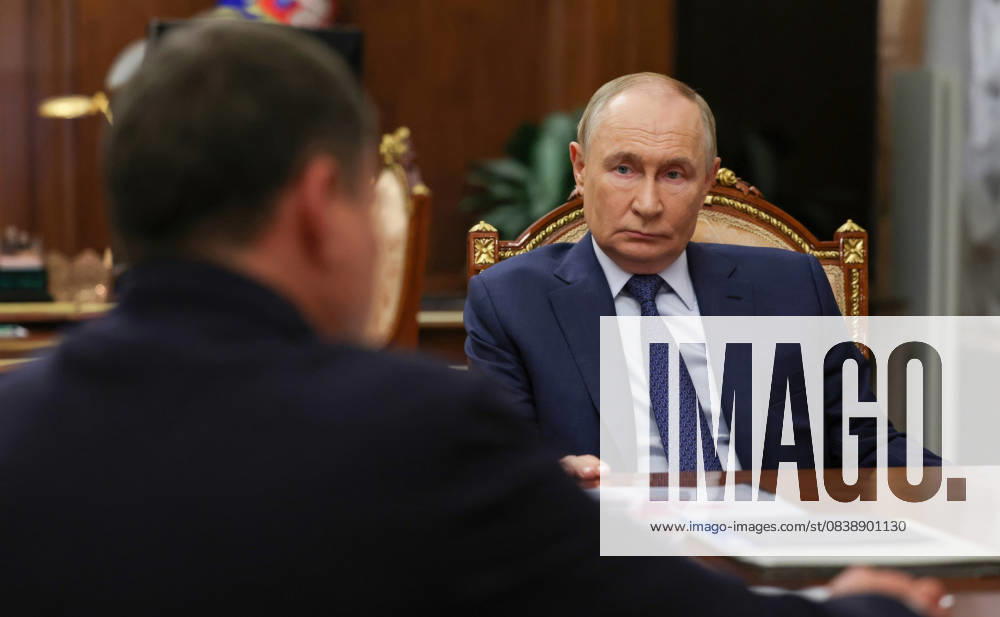 Russian President VLADIMIR PUTIN, right, listens to Rusnano Management Company Chairman and CEO SERGEI KULIKOV deliver his report during a face-to-face meeting at the Kremlin in Moscow. Moscow Russia - ZUMAp138 20251030_zaa_p138_001
