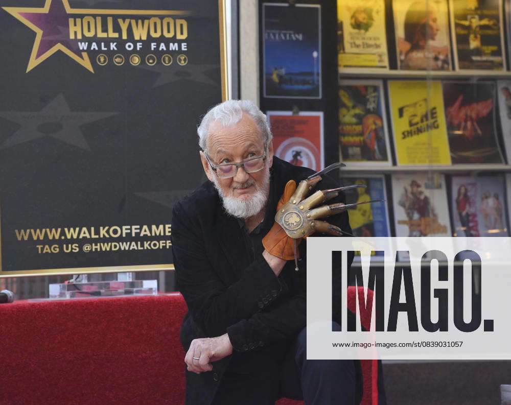 American actor and director Robert Englund, who is best known for his portrayal of the villainous Freddie Krueger kneels next to his star during an unveiling ceremony honoring him with the 2, 826th star on the Hollywood Walk of Fame in Los Angeles on Friday, October 31, 2025. LAP2025103113 JIMxRUYMEN