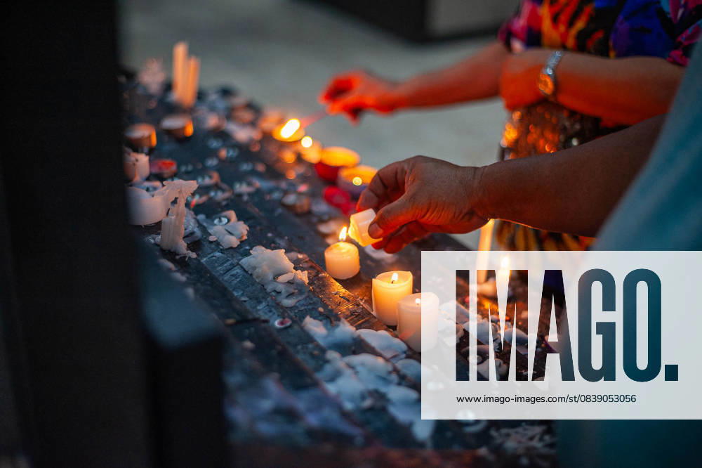 Candles are seen lit and offered as visiting family members and friends pray for their departed loved ones. Quezon City Philippines - ZUMAy102 20251101_zip_y102_042