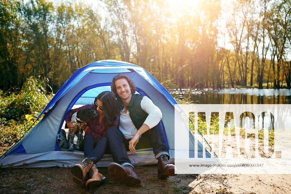 Couple, dog and camping by tent in nature for adventure, freedom and vacation or peace. People, puppy and relax in woods or forest by lake for summer holiday, memory and outdoor experience at morning Couple, dog and camping by tent in nature for adventure, freedom and vacation or peace. People, puppy and relax in woods or forest by lake for summer holiday, memory and outdoor experience at morning., model released, , 59827744.jpg RECORD DATE NOT STATED