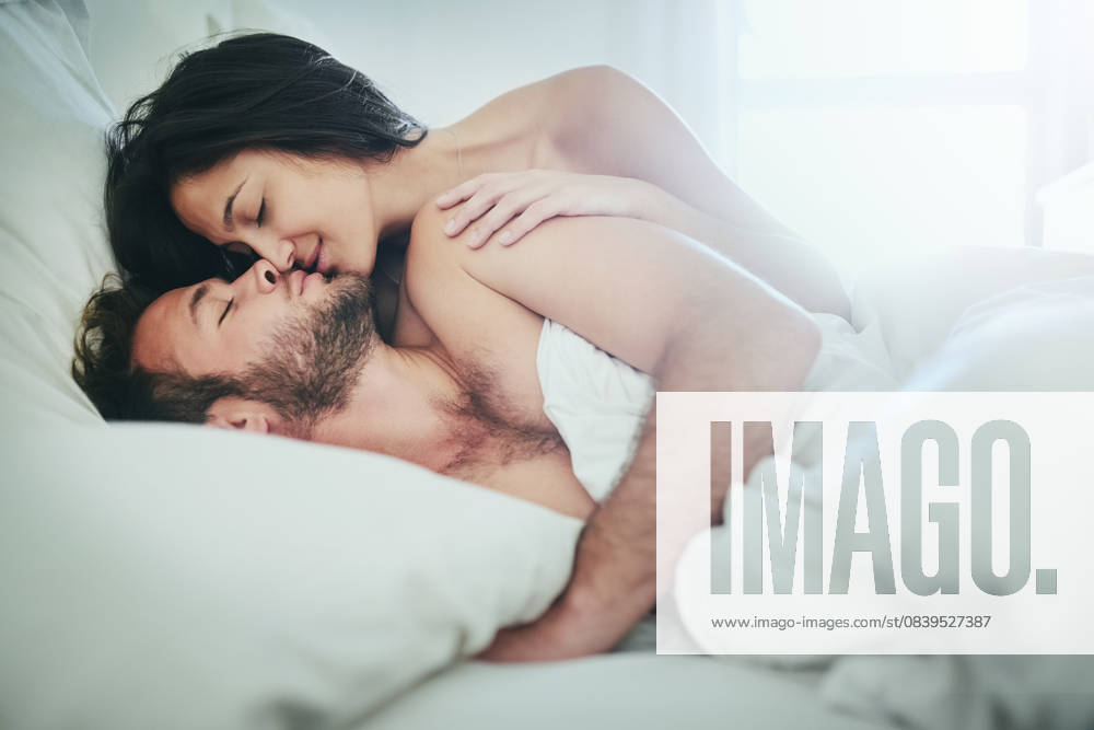 Romance, morning and couple in bed with kiss, love and happy bonding in apartment. Relationship, man and woman relax in bedroom with intimate embrace, passion and wake up with care on weekend in home Romance, morning and couple in bed with kiss, love and happy bonding in apartment. Relationship, man and woman relax in bedroom with intimate embrace, passion and wake up with care on weekend in home., model released, , 59839810.jpg RECORD DATE NOT STATED