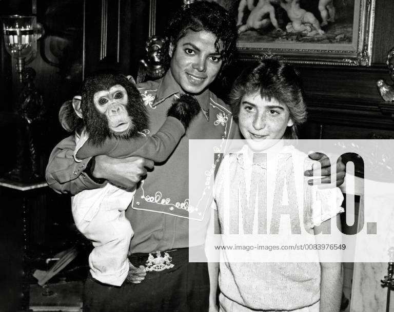 Michael Jackson, poses with 14-year-old fan and his pet chimpanzee Bubbles at the Neverland Ranch circa 1986 File Reference 33595_499THA Hollywood CA USA