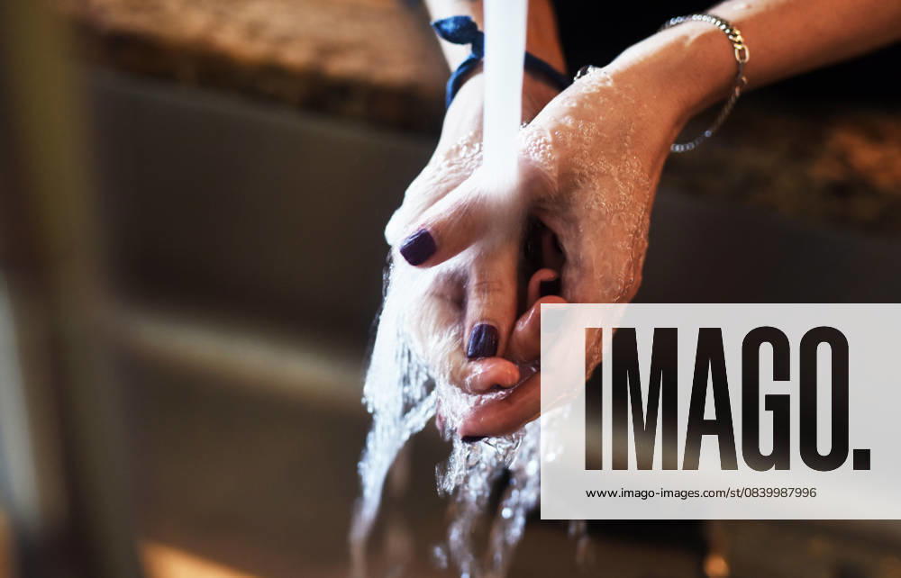 Woman, water and washing hands in home for hygiene, bacteria prevention and disinfection by sink. Healthcare, person and skin cleaning by faucet in house for germ protection, self care and wellness Woman, water and washing hands in home for hygiene, bacteria prevention and disinfection by sink. Healthcare, person and skin cleaning by faucet in house for germ protection, self care and wellness., model released, , property released, , 62889964.jpg RECORD DATE NOT STATED