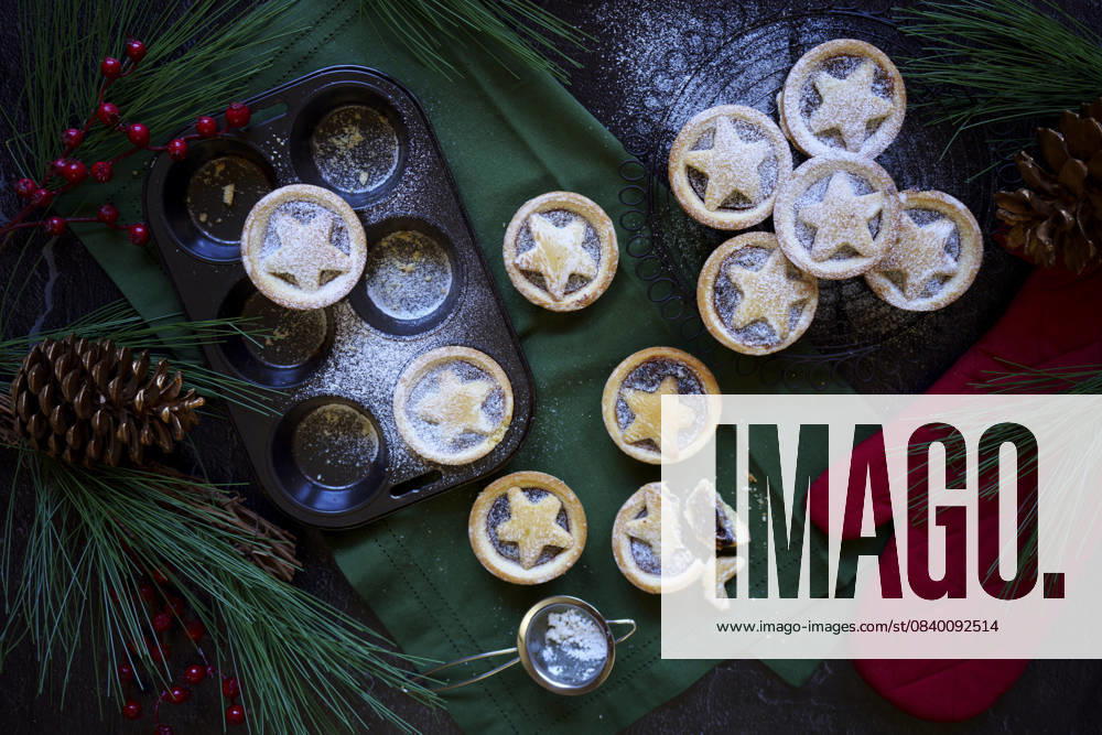Fruit mince pies in festive holiday background setting. Fruit mince pies in festive holiday background setting.
