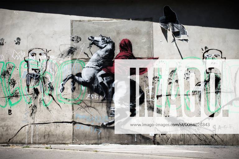 A recent artwork by street artist Banksy in Paris on June 26th, 2018. Anonymous street artist Banksy s artwork of Napoleon Bonaparte wearing a headscarf inspired by the original painting by Jacques-Louis David has been found, in northern Paris over the weekend.