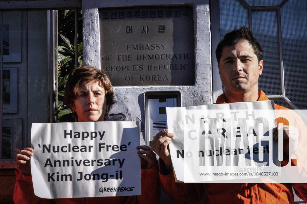 North Korea: Happy Nuclear Free Anniversary Kim Jong-il ROME, ITALY - OCTOBER 8: Greenpeace demonstration in front of the North Korean Embassy to protest against nuclear testing and to deliver a letter of protest from Greenpeace to the North Korean Ambassador. North Korean leader Kim Jong-il is planning to test nuclear weapons in the coming days, coinciding with the 9th anniversary of his leadership of the country on October 8 th 2006 in Rome, Italy. Rome Lazio Italy