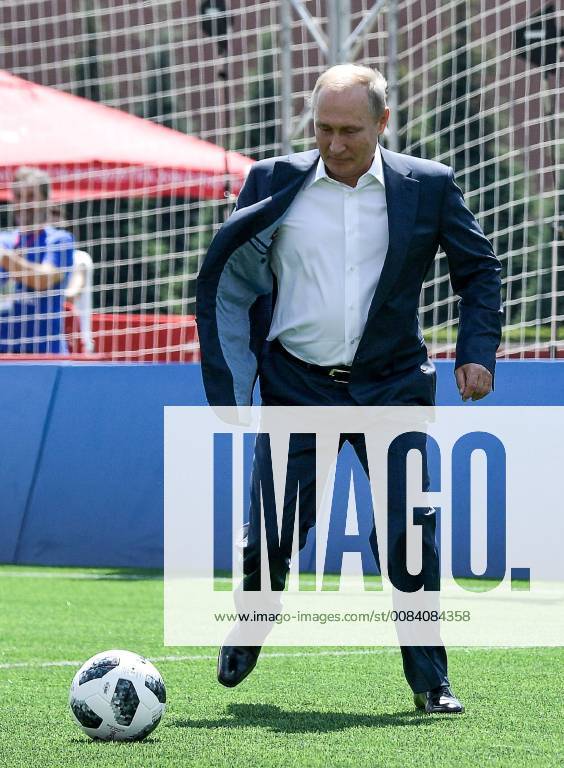 Russia s President Vladimir Putin kicks the ball as he visits the 2018 FIFA World Cup Football Park in Red Square. Alexei Nikolsky Russian Presidential Press and Information Office TASS TS086D77