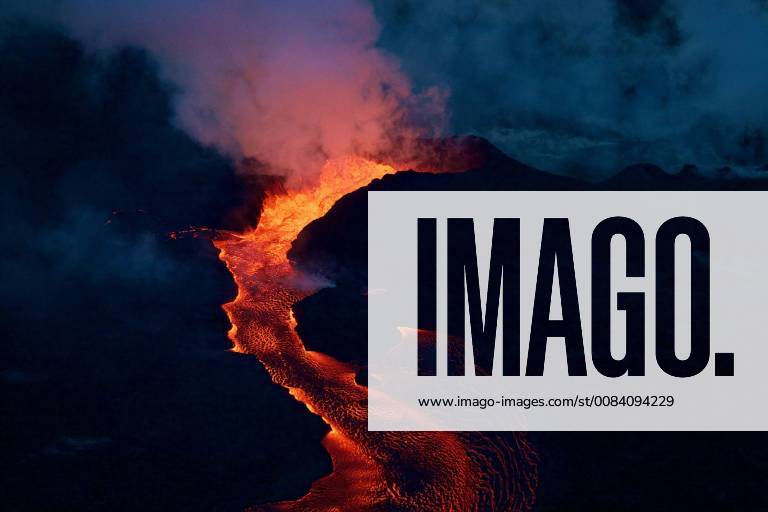 Hawaii, U.S. - Early morning view of Fissure 8. Lava roils and pours out of the spatter cone into the open channel. U.S. - ZUMAz03_ 20180628_sha_z03_043