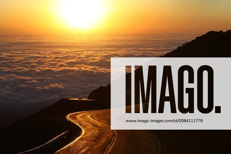 America State of Colorado Springs The Fanfest of the Pikes Peak Mountain Races is the biggest party in the city Motorsports Pikes Peak International Hill Climb 2018 The fastest electric car in the world on the mountain is a VW sunrise over the clouds road in the sunrise