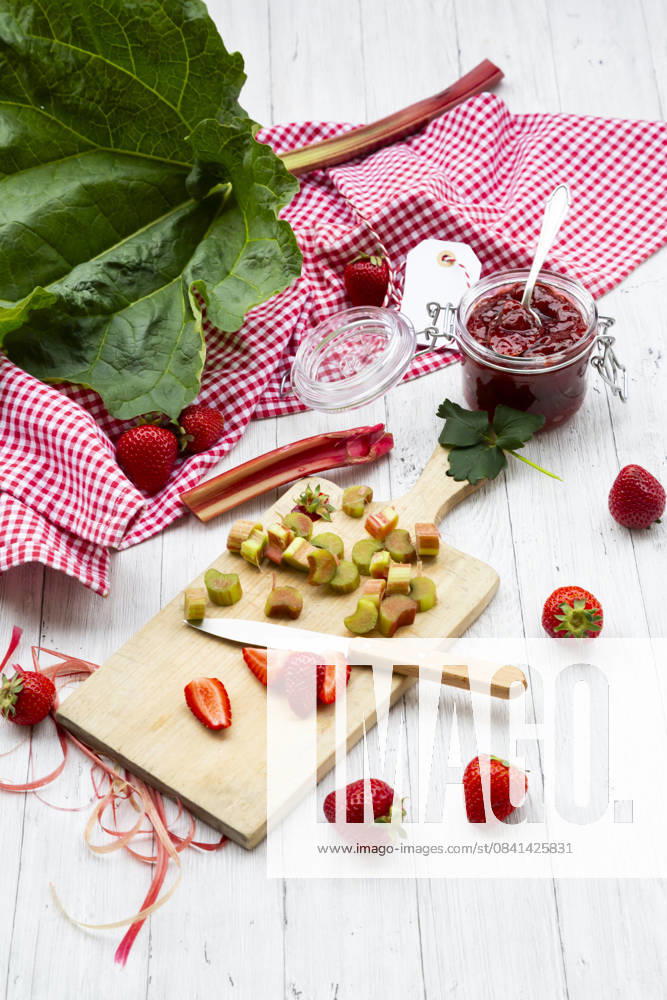 Strawberry and rhubarb jam with fresh ingredients on wood, LVF09554