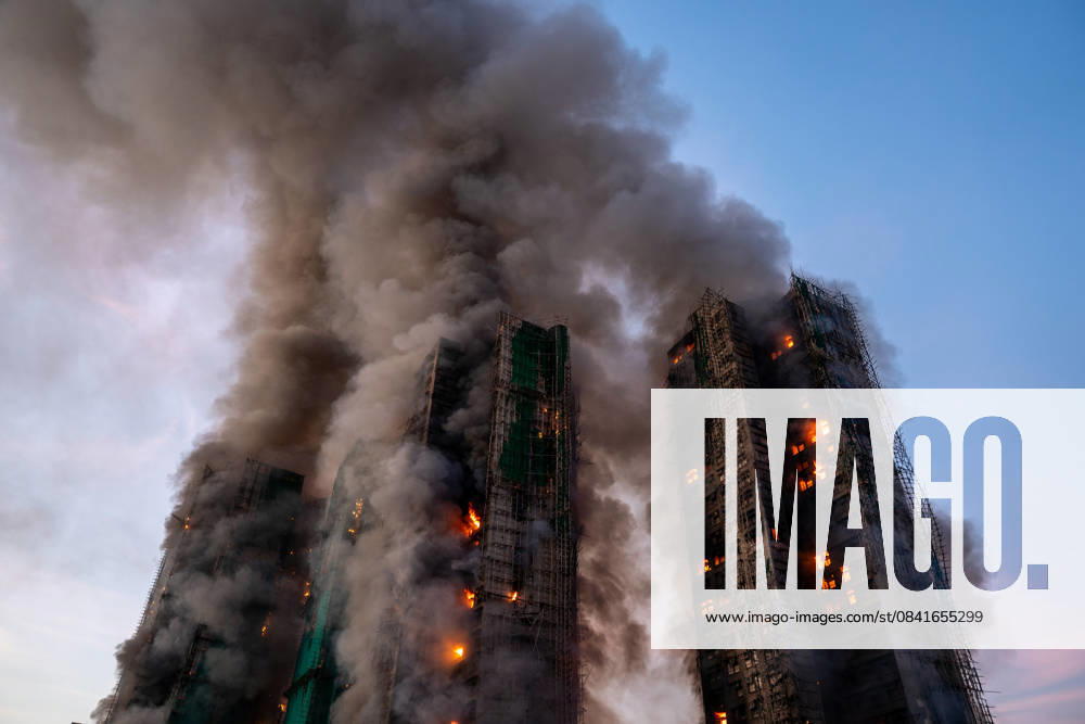 Hong Kong Building Fire Smoke and flames rise as a major fire engulfs several residential buildings at Wang Fuk Court on November 26, 2025 in Hong Kong. Serval residential building in Wang Fuk Court located in Tai Po District caught fire today, the Hong Kong Fire Department has issued the No.5 fire alarm, the fire at local time 1800 has claimed the life of one firefighter and three other people. (Photo by Vernon Yuen Nexpher Images) Hong Kong