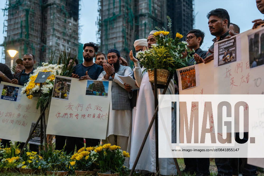 Hong Kong Building Fire A group of mourners praying near Wang Fuk Court housing complex in Tai Po following a deadly fire on November 30, 2025 in Hong Kong. (Photo by Vernon Yuen Nexpher Images) Hong Kong