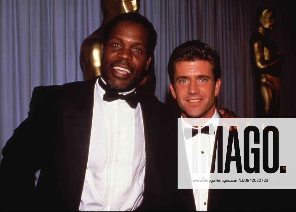 Mel Gibson with Danny Glover at the 60th Annual Academy Awards April 11, 1988