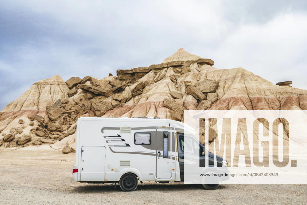 Motorhome parked in the Bardenas Reales Natural Park, Navarra, Spain. Road trip and van life adventure through the arid desert landscape of northern Spain. Model Released SylviePm_ID32630_1111742_016