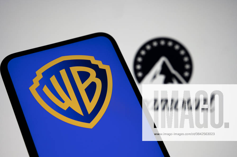Photo Illustrations Of The Netflix Paramount Battle For The Acquisition Of Warner Bros. In this photo illustration, the Warner Bros. logo appears on a cell phone with the Paramount logo in the background in Creteil, France, on December 10, 2025. CrÃ teil France