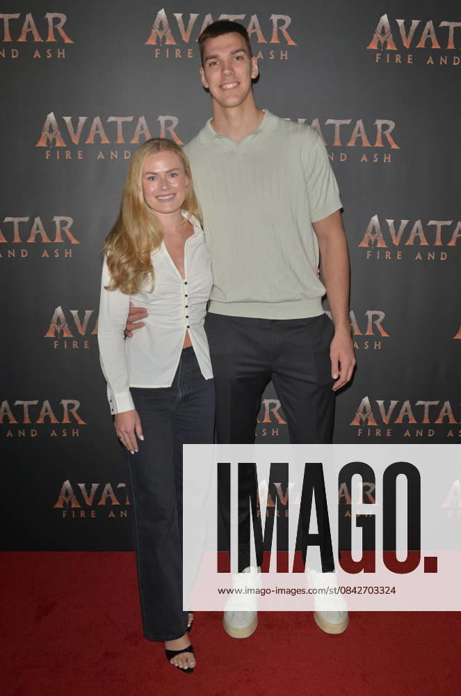 MIAMI, FLORIDA - DECEMBER 12: Vladislav Goldin, NBA Miami Heat Player and Camryn Vogler (L) attend the Miami Special Screening of Avatar: Fire and Ash at AMC Sunset Place 24 in Miami, Florida on December 12, 2025.