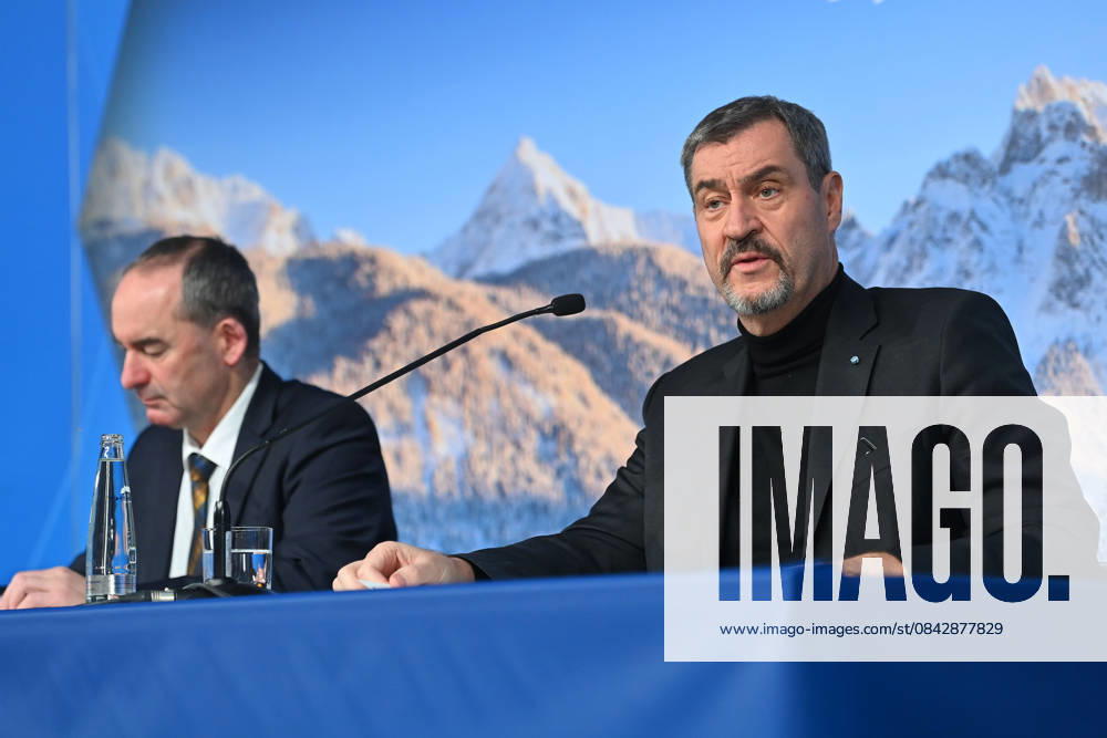 From left Hubert AIWANGER Free Voters, Bavarian Minister of Economic Affairs, Markus SOEDER State Premier of Bavaria and CSU Chairman in front of a wintry Alpine backdrop, press conference of the Bavarian State Government after the cabinet meeting on 16 12 2025 in the Prinz Carl Palais in Munich