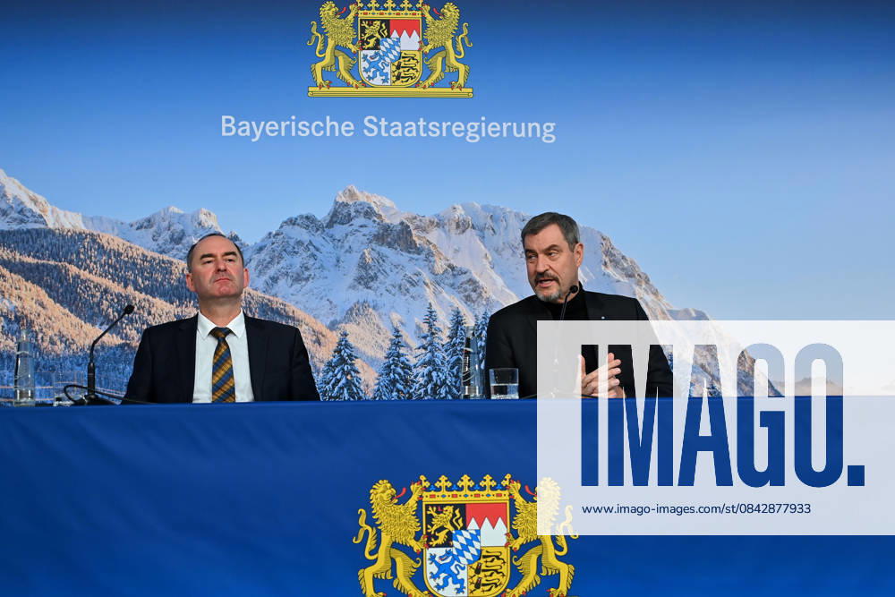 From left Hubert AIWANGER Free Voters, Bavarian Minister of Economic Affairs, Markus SOEDER State Premier of Bavaria and CSU Chairman in front of a wintry Alpine backdrop, press conference of the Bavarian State Government after the cabinet meeting on 16 12 2025 in the Prinz Carl Palais in Munich