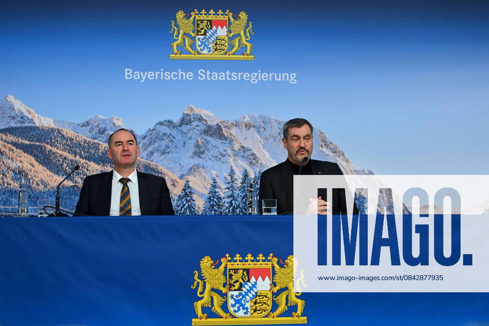 From left Hubert AIWANGER Free Voters, Bavarian Minister of Economic Affairs, Markus SOEDER State Premier of Bavaria and CSU Chairman in front of a wintry Alpine backdrop, press conference of the Bavarian State Government after the cabinet meeting on 16 12 2025 in the Prinz Carl Palais in Munich