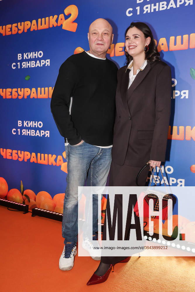 RUSSIA, MOSCOW - DECEMBER 24, 2025: Actor, producer, director Sergei Ginzburg poses with his wife Olga Vinichenko on the red carpet during the premiere of the family comedy Cheburashka 2 by Dmitry Dyachenko at the KARO 11 Oktyabr cinema on Novy Arbat Street (New Arbat Avenue). Valery Sharifulin TASS 86692234