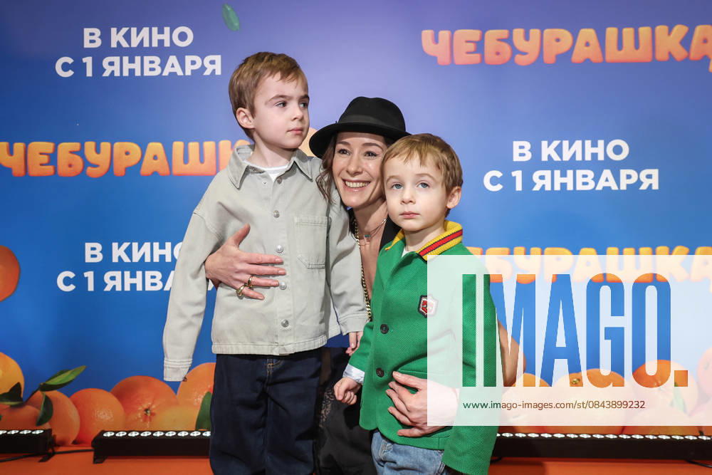 RUSSIA, MOSCOW - DECEMBER 24, 2025: Actress Olga Sutulova poses with children on the red carpet during the premiere of the family comedy Cheburashka 2 by Dmitry Dyachenko at the KARO 11 Oktyabr cinema on Novy Arbat Street (New Arbat Avenue). Valery Sharifulin TASS 86692668