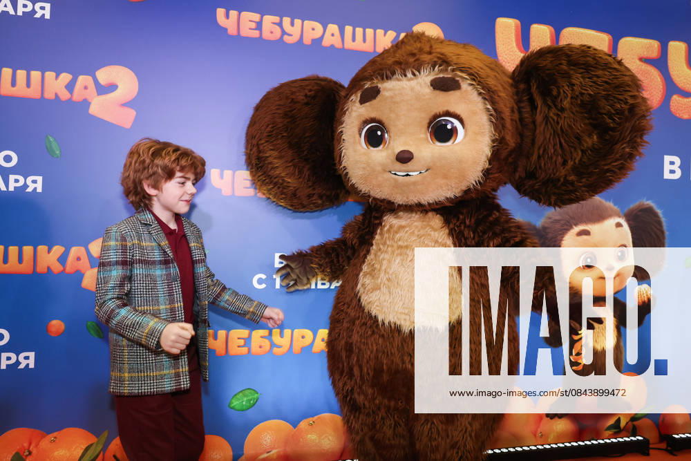 RUSSIA, MOSCOW - DECEMBER 24, 2025: Actor Ilya Kondratenko poses with an artist cosplaying the title character on the red carpet during the premiere of the family comedy Cheburashka 2 by Dmitry Dyachenko at the KARO 11 Oktyabr cinema on Novy Arbat Street (New Arbat Avenue). Valery Sharifulin TASS 86692118