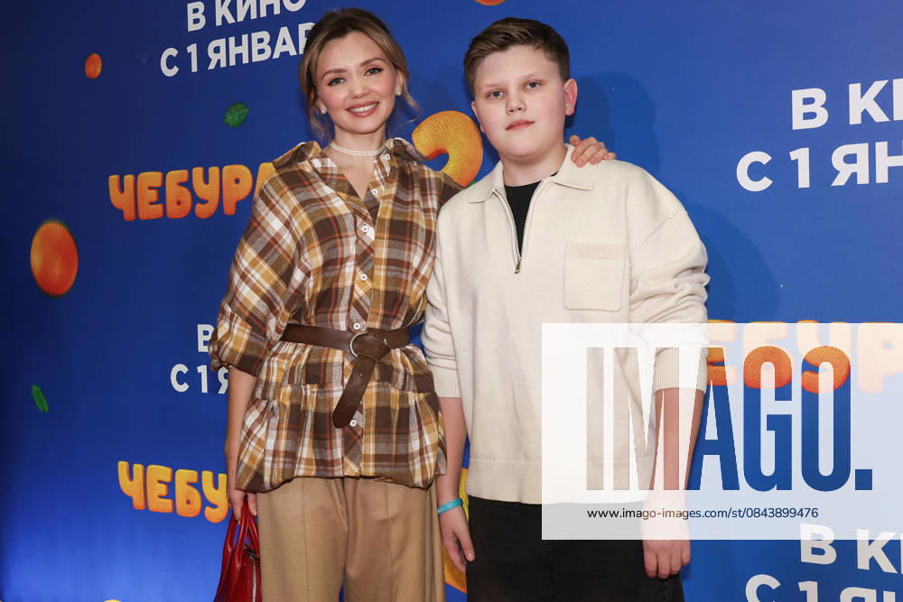 RUSSIA, MOSCOW - DECEMBER 24, 2025: Actress Olga Kuzmina poses with her son Gordey on the red carpet during the premiere of the family comedy Cheburashka 2 by Dmitry Dyachenko at the KARO 11 Oktyabr cinema on Novy Arbat Street (New Arbat Avenue). Valery Sharifulin TASS 86692612