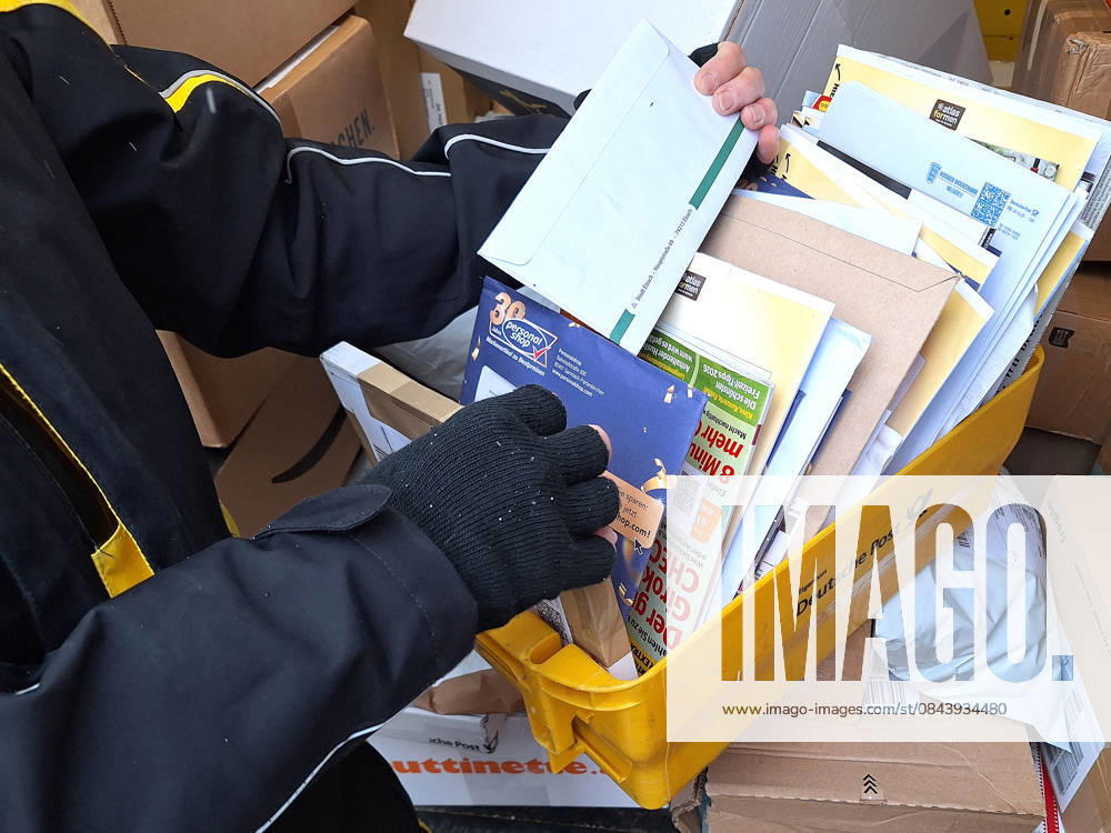 Winch theme picture Deutsche Post, DHL, letter carrier, letter carrier, delivering letters and parcels theme picture Deutsche Post, DHL, letter carrier, letter carrier, delivering letters and parcels letter carrier, postman, parcel carrier, letter carrier with his post van, postal vehicle delivering mail and parcel, parcel scanning, parcel and letter delivery, symbol