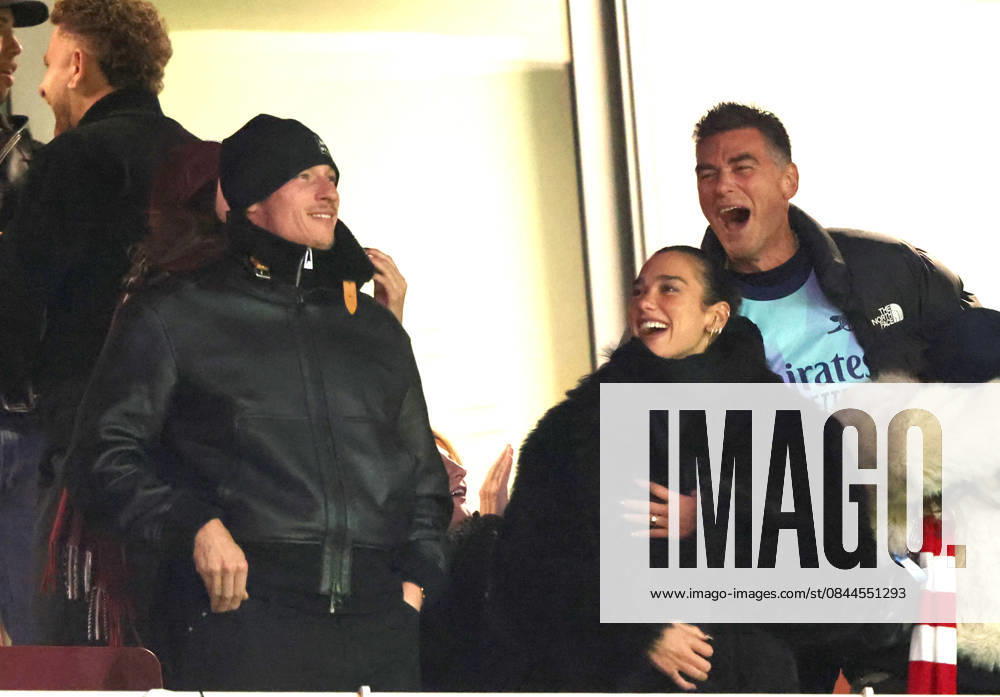 Dua Lipa celebrates an Arsenal goal, alongside Callum Turner at the Arsenal v Aston Villa EPL match, at the Emirates Stadium, London, UK on 30th December, 2025.