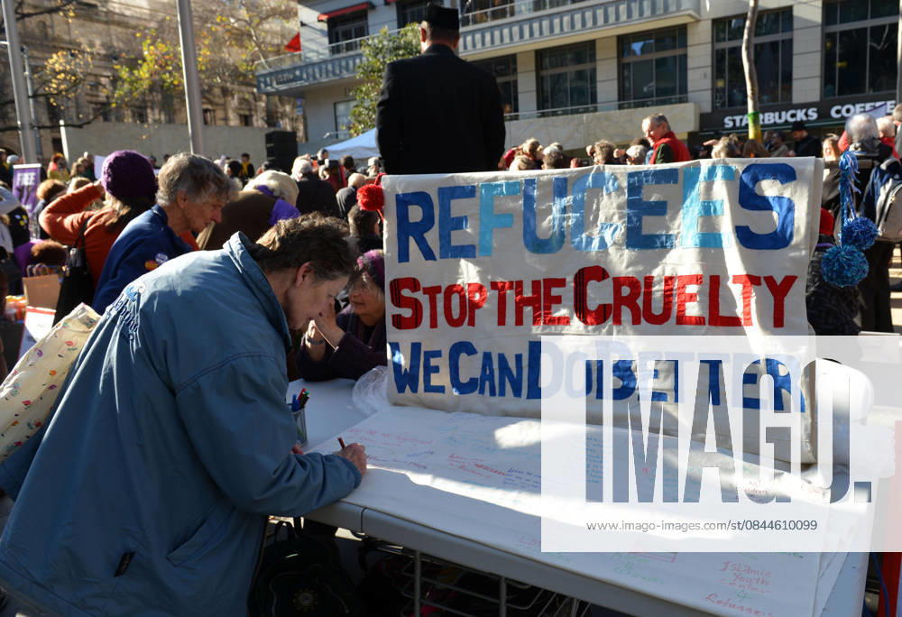 World Refugee Day in Melbourne MELBOURNE, AUSTRALIA - JUNE 21: People hold banners as they gather to mark World Refugee Day in Melbourne, Australia on June 21, 2015. Queensland Australia. Editorial use only. Please get in touch for any other usage.