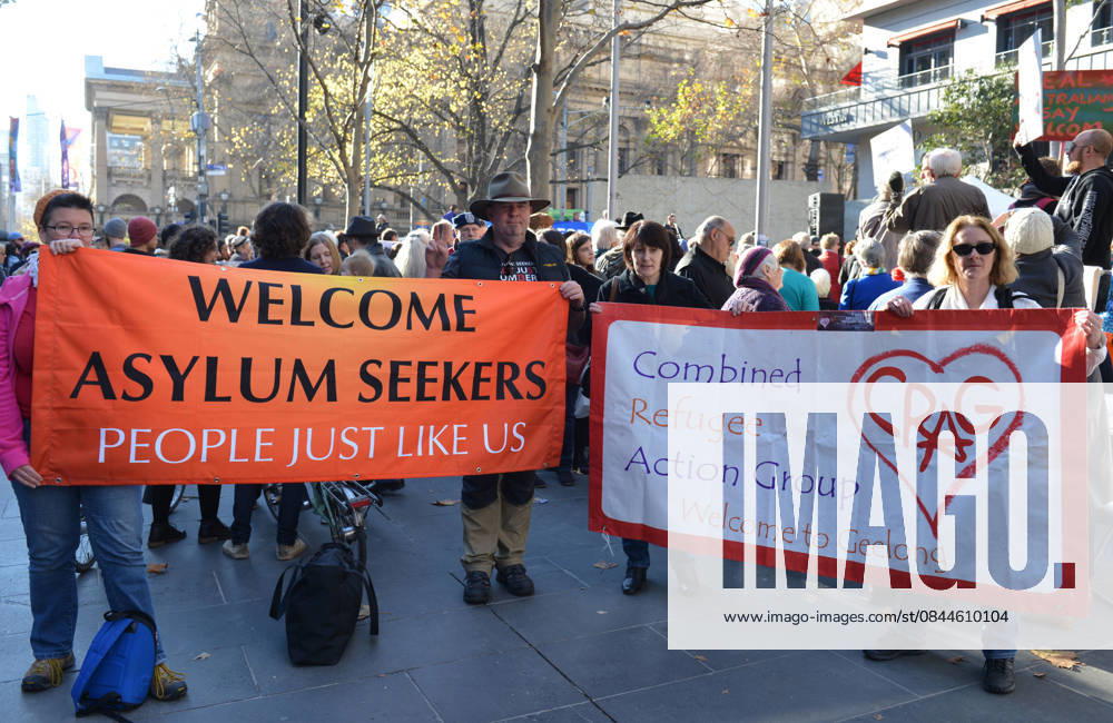 World Refugee Day in Melbourne MELBOURNE, AUSTRALIA - JUNE 21: People hold banners as they gather to mark World Refugee Day in Melbourne, Australia on June 21, 2015. Queensland Australia. Editorial use only. Please get in touch for any other usage.