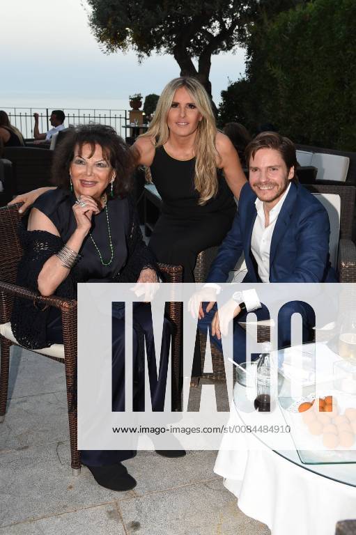 Taormina: Cinematographic Nations Award Evening. Photo: Tiziana Rocca between Claudia Cardinale and Daniel Bruhl