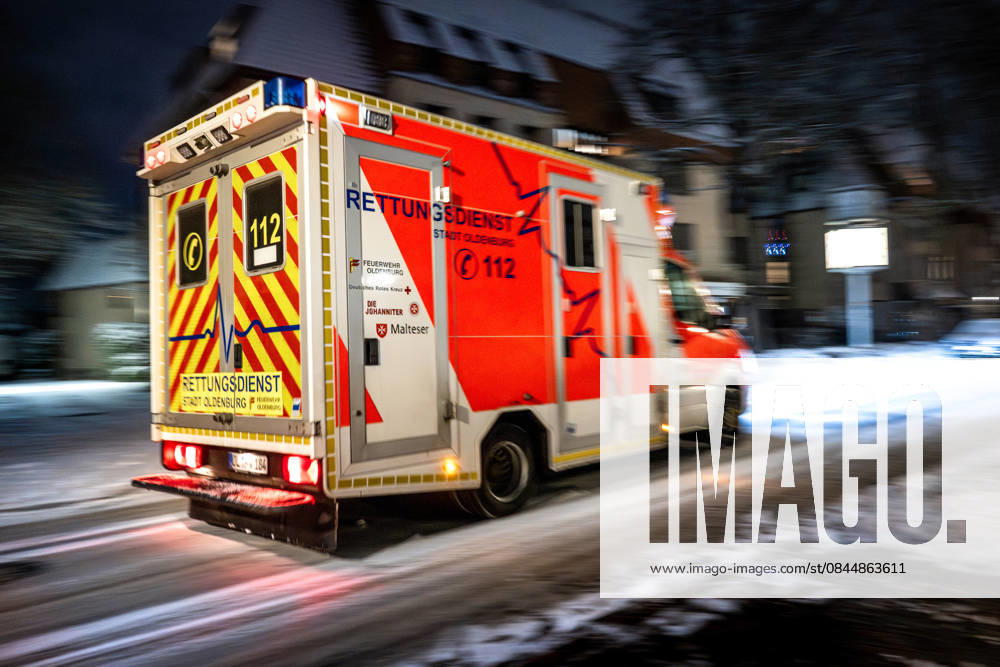 Ambulance in road traffic in winter conditions in the evening Oldenburg, Germany, 03 01 2026 Rear view of an ambulance in road traffic in winter conditions in Oldenburg in the evening