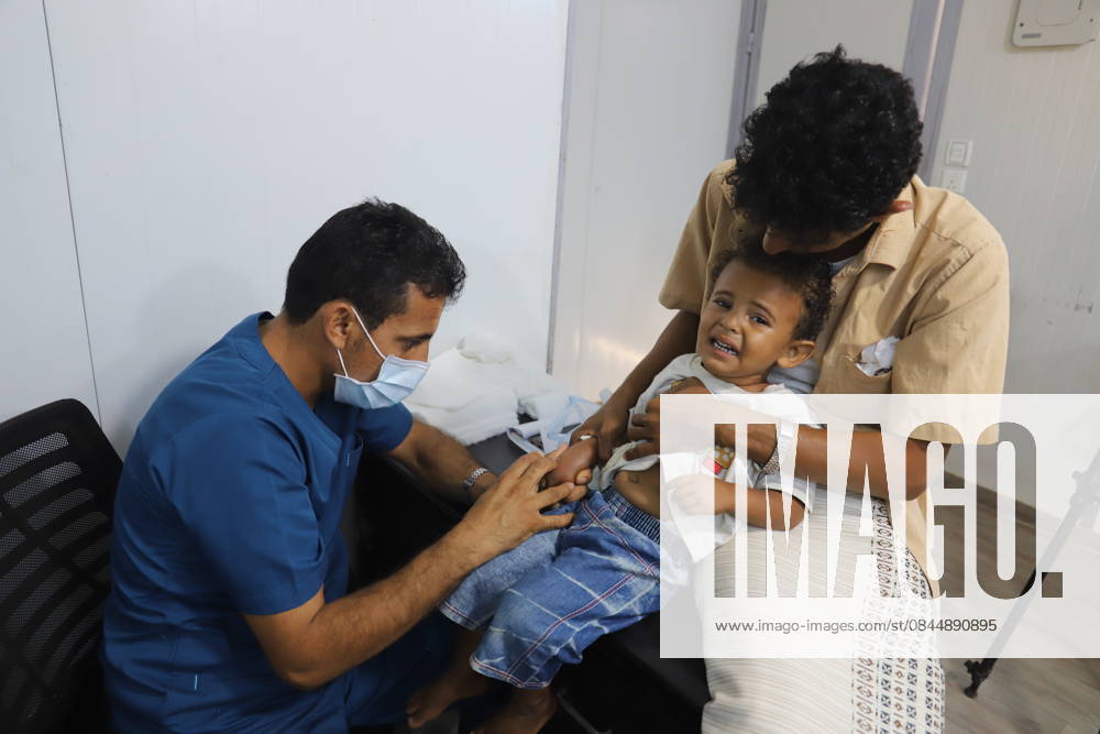 Thousands of children in Yemen have no access to vaccination and health services due to conflicts HAJJAH, YEMEN - FEBRUARY 1: A doctor checks a kid baby as admission to the facility exceeds more than 300 in a day at Jada Health Facility in Maidi district of Hajjah city, Yemen on February 1, 2022. Children of thousands of families who forced to move to safe areas in Hajjah city, were deprived of health services, especially necessary vaccines such as polio, diphtheria, measles and hepatitis B due to ongoing violence and conflict. Yemen has been engulfed by violence and instability since 2014, when Iran-aligned Houthi rebels captured much of the country, including the capital Sanaa. Yemen World. Editorial use only. Please get in touch for any