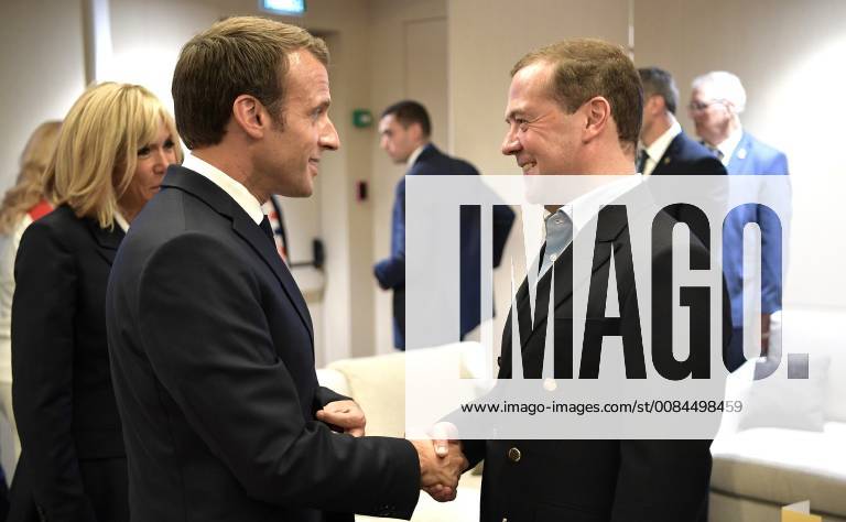 Moscow, Russia - French President Emmanuel Macron, left, is congratulated by Russian Prime Minister Dmitry Medvedev during the 2018 FIFA World Cup Final at Luzhniki stadium July 15, 2018 in Moscow, Russia. France defeated Croatia 4-2. Moscow Russia - ZUMAp138 20180715_zaa_p138_009