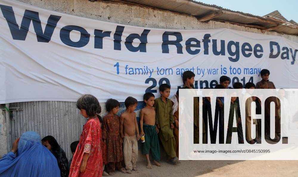 World Refugee Day ISLAMABAD, PAKISTAN - JUNE 20: Afghan refugee children stand outside a free medical camps and free eye camp organized by United Nations Refugee Agency (UNHCR) on the eve of World Refugee Day on June 20, 2014, in Islamabad, Pakistan. Each year on June 20th the United Nations, UNHCR and civil groups around the world celebrate World Refugee Day in order to draw the public s attention to the millions of refugees and Internally displaced persons worldwide who have been forced to flee their homes due to war, conflict and persecution. Islamabad Pakistan. Editorial use only. Please get in touch for any other usage.