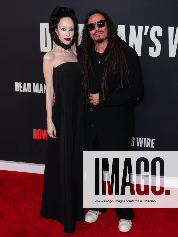 Los Angeles Premiere Of Row K Entertainment s Dead Man s Wire LOS ANGELES, CALIFORNIA, USA - JANUARY 07: Evis Xheneti Shaffer and husband James Shaffer of American nu metal band Korn arrive at the Los Angeles Premiere Of Row K Entertainment s Dead Man s Wire held at AMC The Grove 14 on January 7, 2026 in Los Angeles, California, United States., Credit:Xavier Collin Avalon United States, California, Los Angeles, AMC The Grove 14