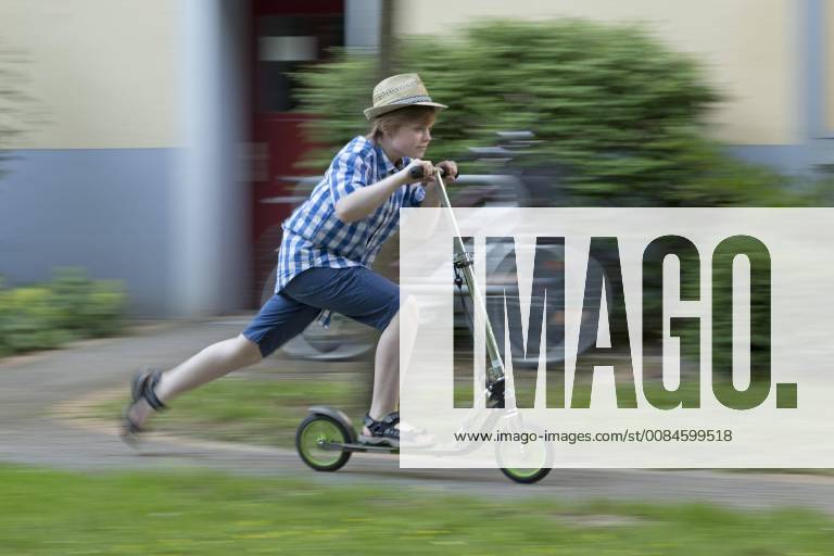 Boy is riding scooter