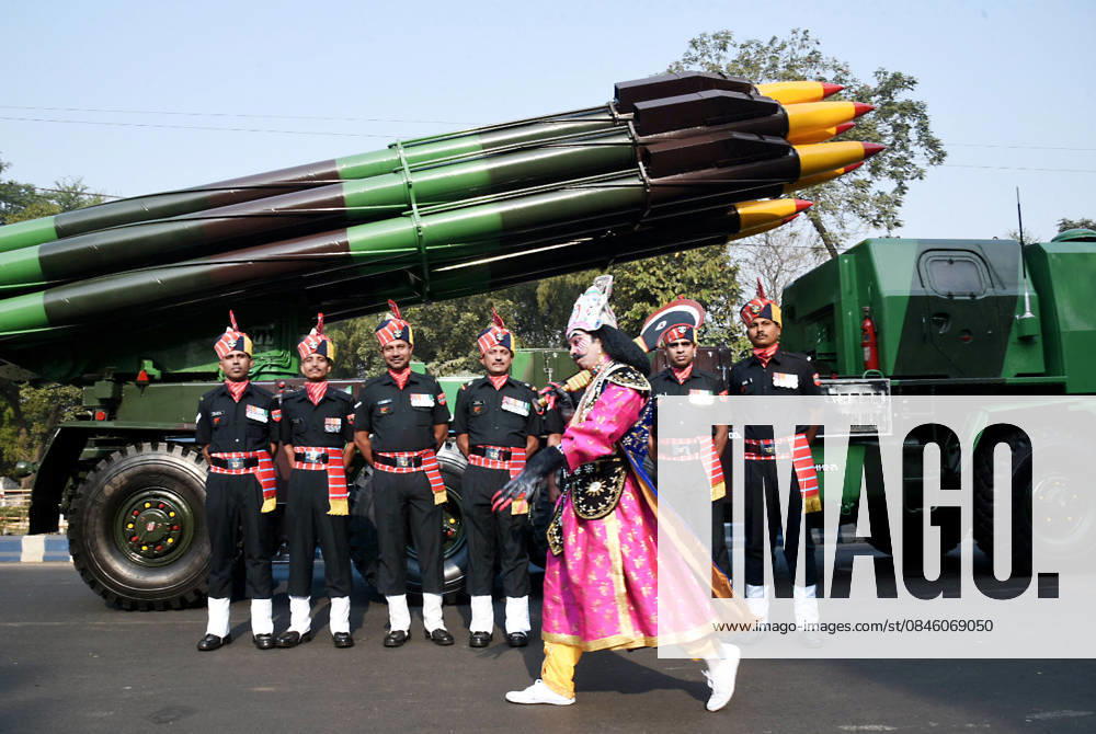 An artist dressed as Ravana walks past army personnel and a rocket launcher vehicle during a Republic Day parade rehearsal Kolkata, Jan 24 (ANI): An artist dressed as Ravana walks past army personnel and a rocket launcher vehicle during the Republic Day parade rehearsal at Red Road, in Kolkata on Saturday. Kolkata West Bengal India