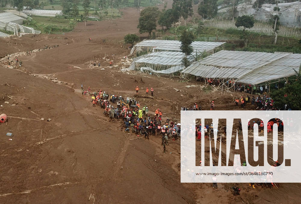 Indonesia landslide death toll climbs to 25 as dozens still missing WEST JAVA, INDONESIA - JANUARY 26 : An aerial view of a landslide that buried dozens of houses and plantations, leaving dozens of victims, that occurred at around 2 a.m. on Saturday (January 24) in Bandung Regency, West Java, Indonesia, photographed on January 26, 2026. The landslide was caused by heavy rain, and landslide activity upstream along the slope formed a natural dam, blocking the flow of water and sediment until it eventually broke, triggering a flow of mud mixed with sand, rocks and wood downstream. As a result, the affected homes were not damaged at the landslide site itself, but by the debris carried downstream through the river channel. Dasril Roszandi Anad
